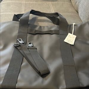 Rains Black Tote Bag.